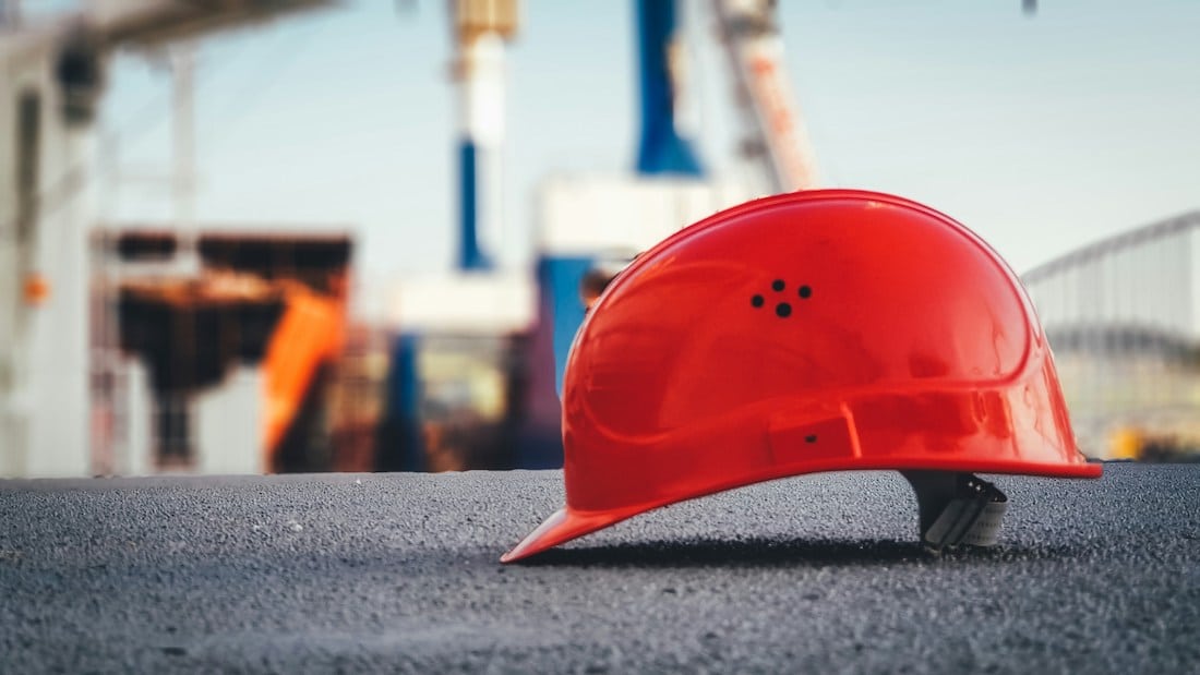 property development loans - hard hat at construction site